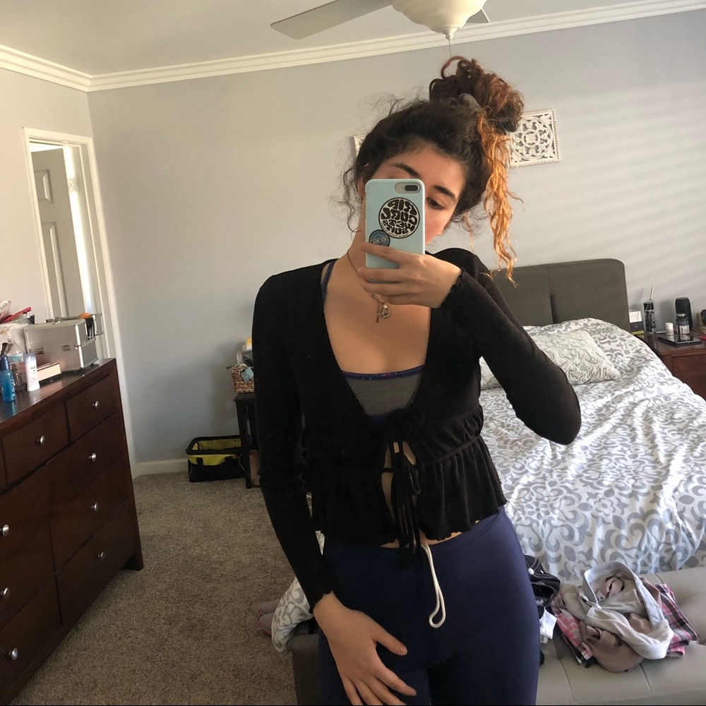 Black long sleeve ties twice in front